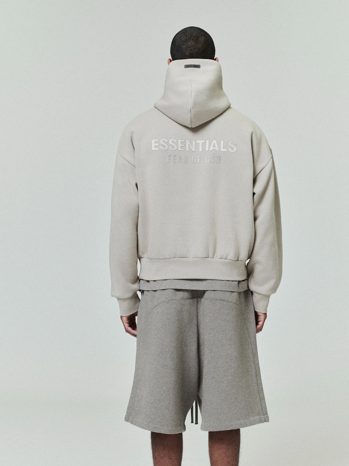 FEAR OF GOD ESSENTIALS Metallic Logo Fleece Hoodie ‘Timber’ SP25