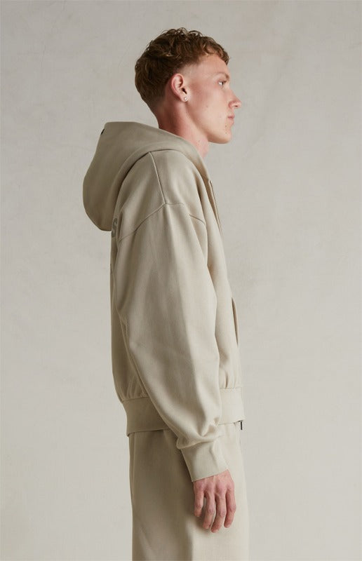 FEAR OF GOD ESSENTIALS Metallic Logo Full Zip Hoodie ‘Timber’ SP25