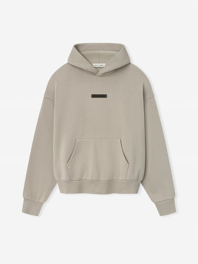 FEAR OF GOD ESSENTIALS Metallic Logo Fleece Hoodie ‘Timber’ SP25