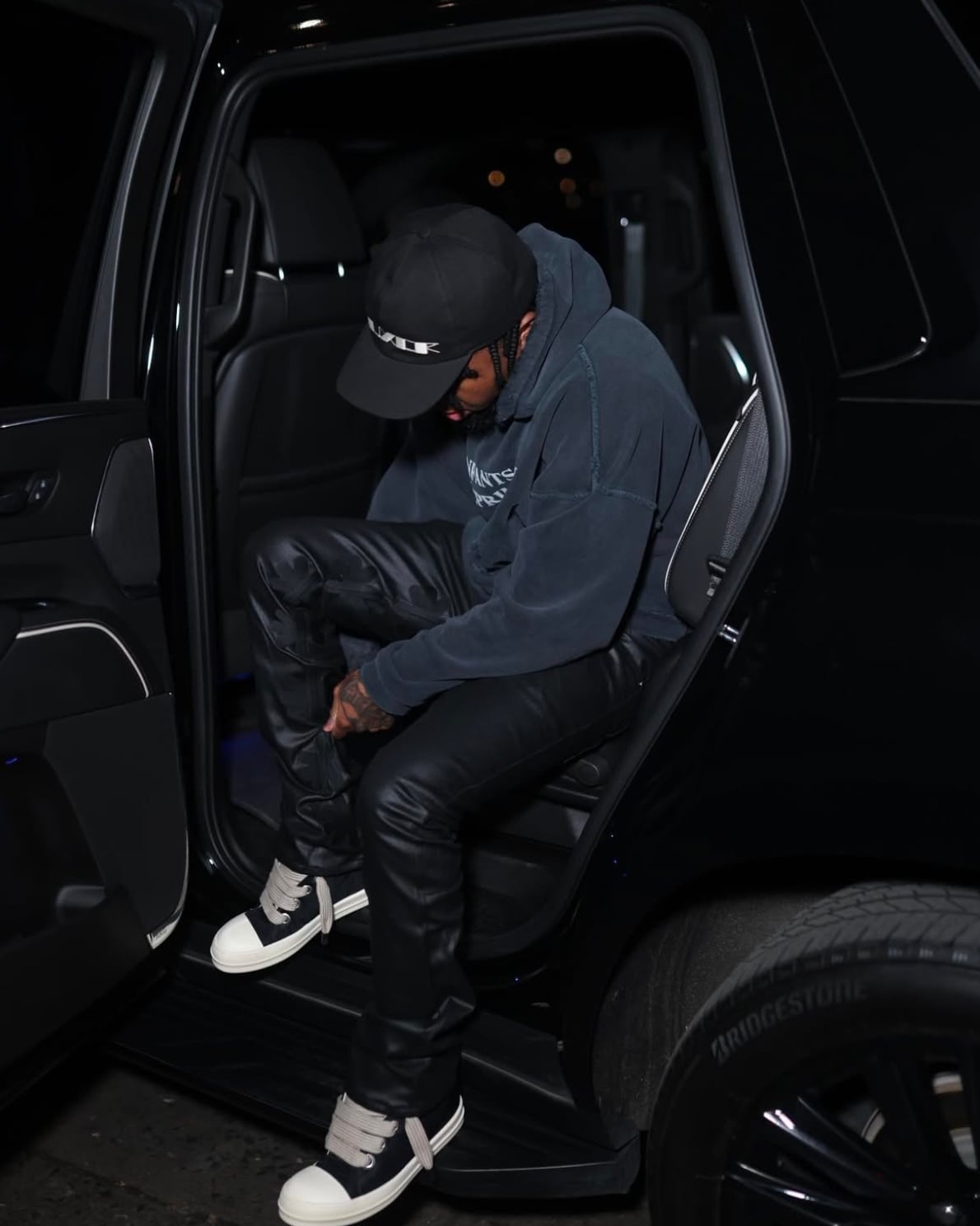 LOSTSHDWS Sun Logo Washed Flared Denim Jeans with Embroidered Details