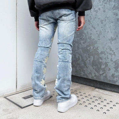 LOSTSHDWS Sun Logo Washed Flared Denim Jeans with Embroidered Details