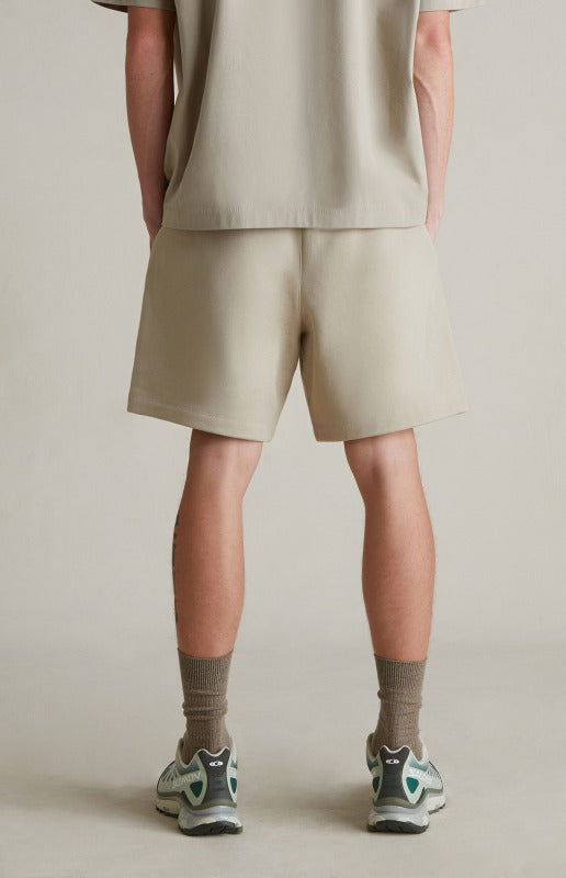 Fear of God Essentials SP25 Metallic Logo Shorts ‘Heather Stone’