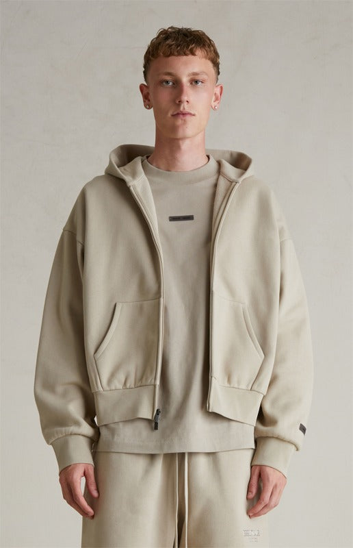 FEAR OF GOD ESSENTIALS Metallic Logo Full Zip Hoodie ‘Timber’ SP25