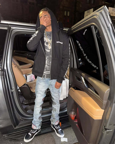 LOSTSHDWS Sun Logo Washed Flared Denim Jeans with Embroidered Details